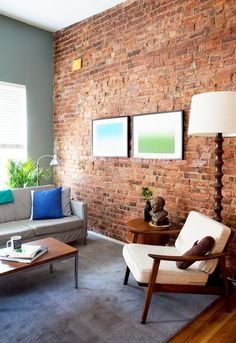 an exposed brick wall in an incredible chic and affordable apartment... I don't think that's too much to as