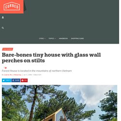 Bare-bones tiny house with glass wall perches on stilts