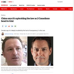 China says it's upholding the law as 2 Canadians head to trial
