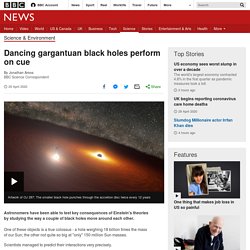 Dancing gargantuan black holes perform on cue