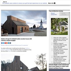Dekleva Gregorič Arhitekti builds wooden house with chimney-shaped skylight