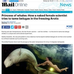 Naked female scientist tries to tame beluga whales in the arctic