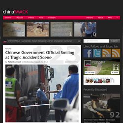 Chinese Government Official Smiling at Tragic Accident Scene