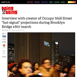 Interview with creator of Occupy Wall Street "bat-signal" projections during Brooklyn Bridge #N17 march
