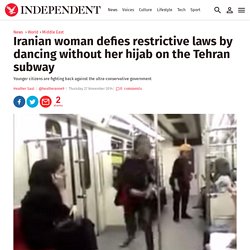 Iranian woman defies restrictive laws by dancing without her hijab on the Tehran subway
