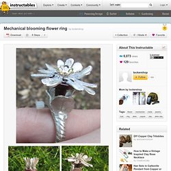 Mechanical blooming flower ring