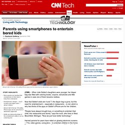 Parents using smartphones to entertain bored kids