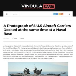 A Photograph of 5 U.S Aircraft Carriers Docked at the same time at a Naval Base
