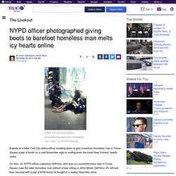 NYPD officer photographed giving boots to barefoot homeless man melts icy hearts online