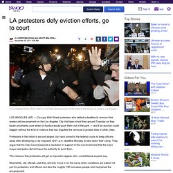 LA protesters defy eviction efforts, go to court