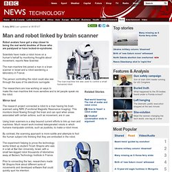 Man and robot linked by brain scanner