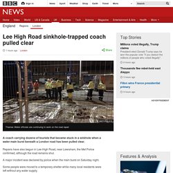 Lee High Road sinkhole-trapped coach pulled clear