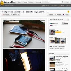 Solar powered arduino on the back of a playing card