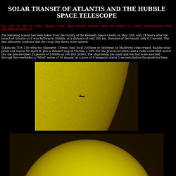 Transit of Atlantis and Hubble in front of the Sun