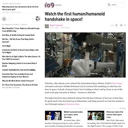 Watch the first human/humanoid handshake in space!
