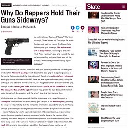 Why do rappers hold their guns sideways?